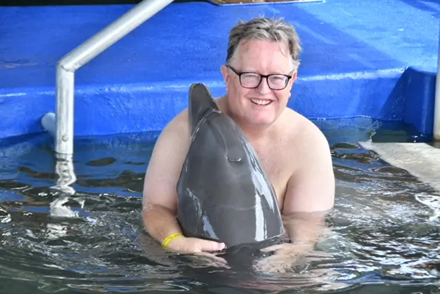 Happy moment with dolphin in water