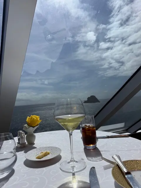 Table setup by ocean-view window