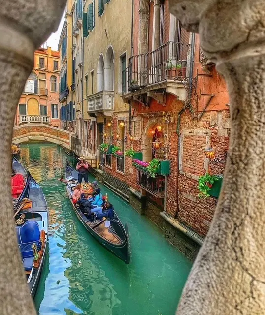 Venetian canal with gondolas and buildings
