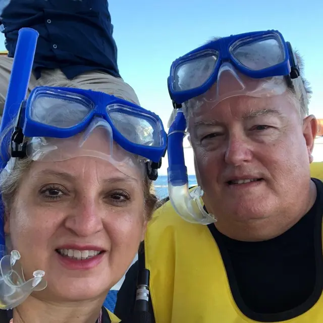 Two people with snorkeling masks